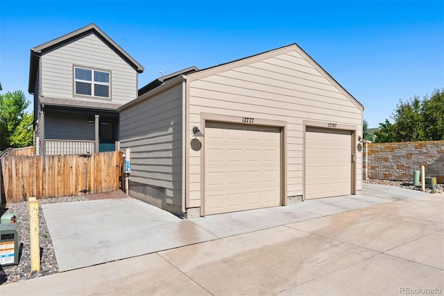 12777 Ulster St, Thornton, CO 80602 - garage with concrete driveway