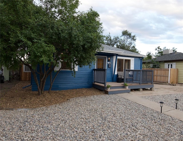 bungalow-style house featuring a wooden deck