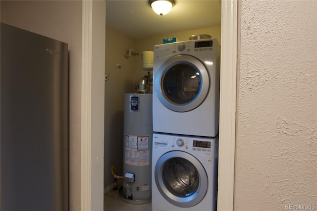 laundry area featuring stacked washer and clothes dryer and water heater