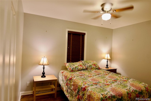 bedroom with ceiling fan and dark hardwood / wood-style flooring