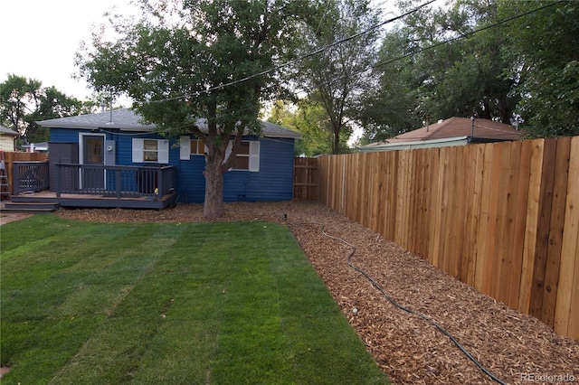 view of yard with a wooden deck