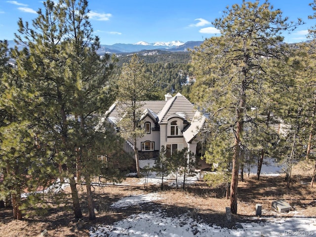 view of front of home with a mountain view