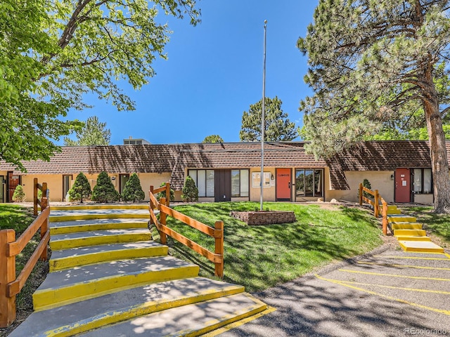 7755 E Quincy Ave Unit 301A7, Denver, CO 80237 - view of front of property featuring stucco siding and a tile roof
