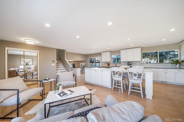 5404 W Rowland Pl, Littleton, CO 80128 - living area featuring stairway, recessed lighting, and light wood-type flooring