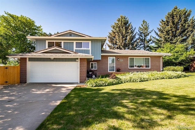 5404 W Rowland Pl, Littleton, CO 80128 - tri-level home featuring driveway, brick siding, and board and batten siding