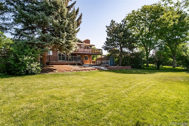 5404 W Rowland Pl, Littleton, CO 80128 - view of green lawn featuring a wooden deck and a shed