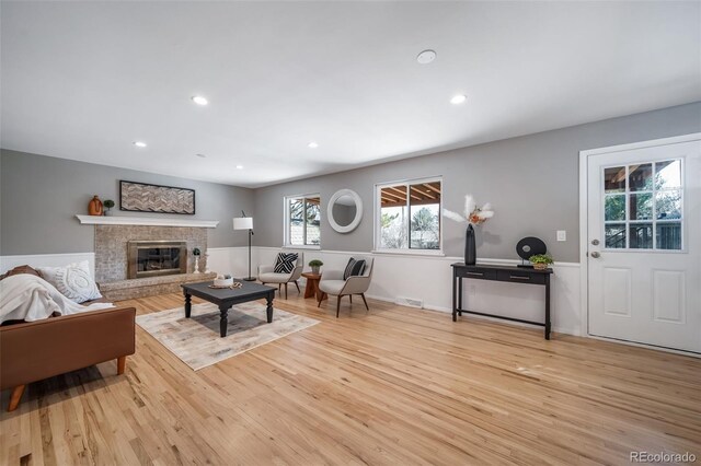 5404 W Rowland Pl, Littleton, CO 80128 - living area featuring light wood finished floors, recessed lighting, and a fireplace