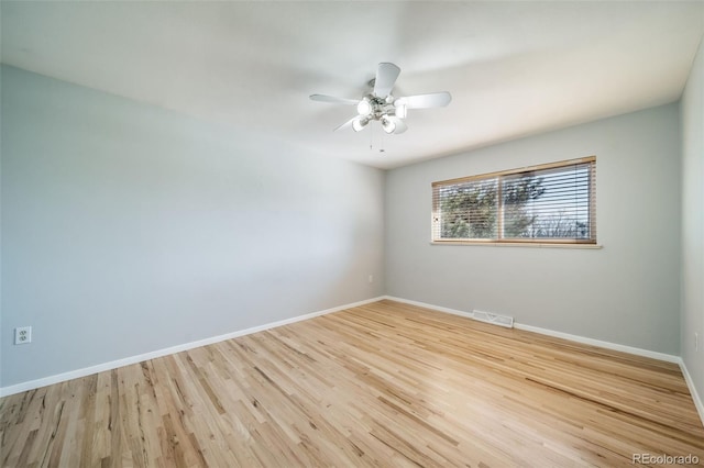 5404 W Rowland Pl, Littleton, CO 80128 - spare room featuring wood finished floors and a ceiling fan