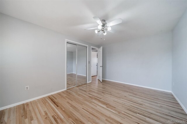 5404 W Rowland Pl, Littleton, CO 80128 - unfurnished bedroom with wood finished floors, a closet, and a ceiling fan