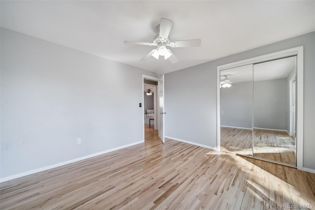 5404 W Rowland Pl, Littleton, CO 80128 - unfurnished bedroom featuring wood finished floors, a closet, and a ceiling fan