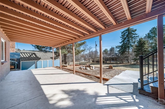 5404 W Rowland Pl, Littleton, CO 80128 - view of patio / terrace with an outbuilding and stairs