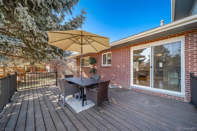 5404 W Rowland Pl, Littleton, CO 80128 - deck featuring outdoor dining area