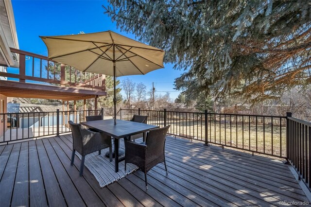 5404 W Rowland Pl, Littleton, CO 80128 - wooden deck with outdoor dining space