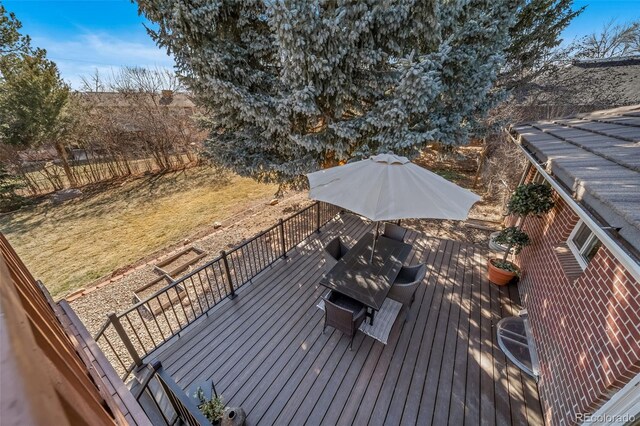 5404 W Rowland Pl, Littleton, CO 80128 - wooden deck featuring outdoor dining area