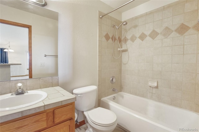 bathroom with toilet, washtub / shower combination, and vanity