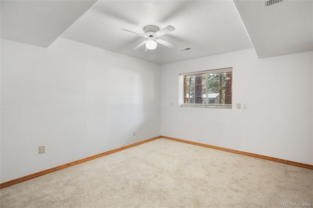 empty room with carpet floors and baseboards