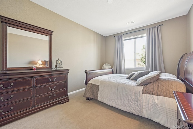 bedroom with light colored carpet