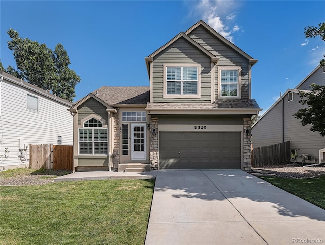 5326 E Hamilton Ave, Castle Rock, CO 80104 - traditional-style house featuring concrete driveway, a garage, a shingled roof, and stone siding