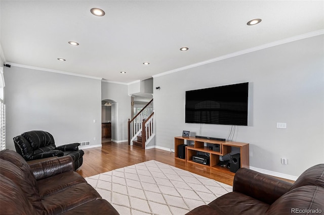 5326 E Hamilton Ave, Castle Rock, CO 80104 - living area featuring arched walkways, recessed lighting, stairway, wood finished floors, and ornamental molding