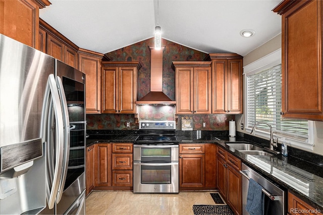 5326 E Hamilton Ave, Castle Rock, CO 80104 - kitchen featuring appliances with stainless steel finishes, wall chimney exhaust hood, lofted ceiling, brown cabinetry, and decorative backsplash