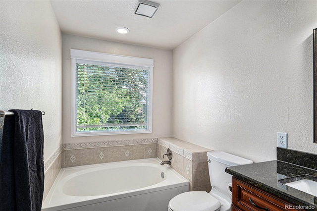 5326 E Hamilton Ave, Castle Rock, CO 80104 - bathroom featuring a textured wall, a garden tub, and vanity