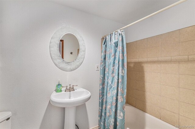 5326 E Hamilton Ave, Castle Rock, CO 80104 - bathroom with shower / bath combination with curtain and toilet
