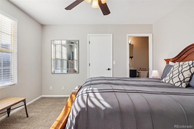 carpeted bedroom with ceiling fan and baseboards