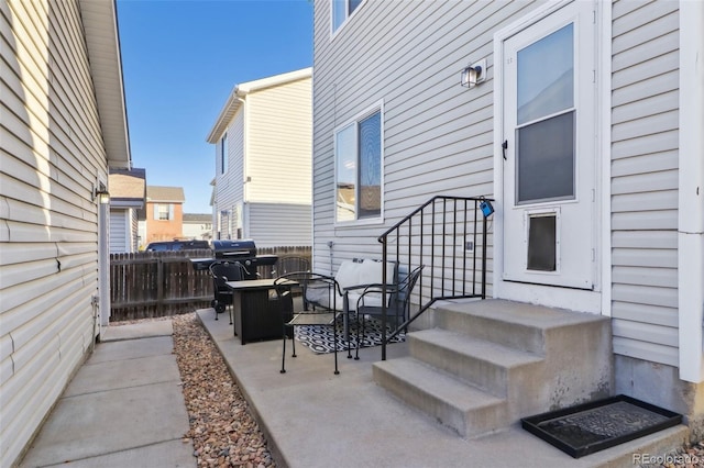 view of patio featuring fence