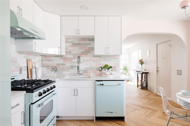 kitchen with white appliances, light countertops, under cabinet range hood, and a sink