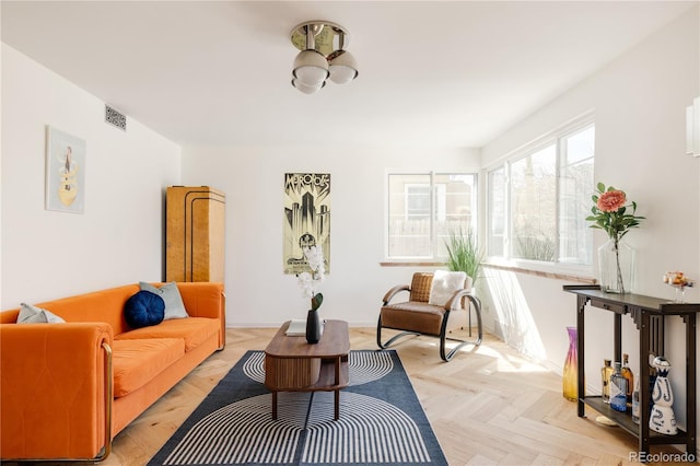 living room with visible vents and baseboards