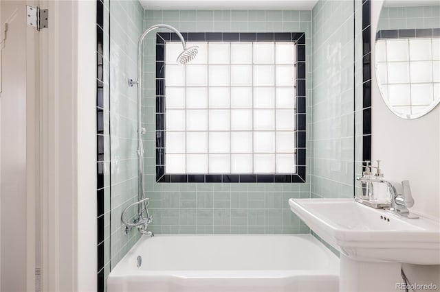 full bathroom with a sink and shower / washtub combination