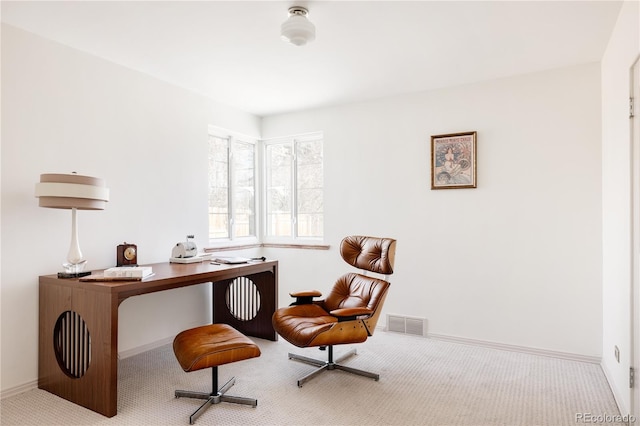 carpeted home office with visible vents and baseboards