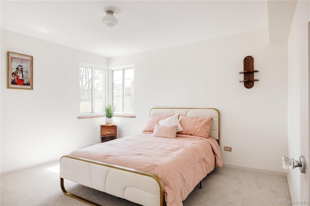 bedroom with baseboards and carpet floors