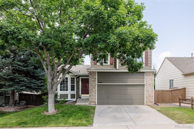 9756 Autumnwood Pl, Highlands Ranch, CO 80129 - view of property hidden behind natural elements featuring a garage, driveway, and brick siding