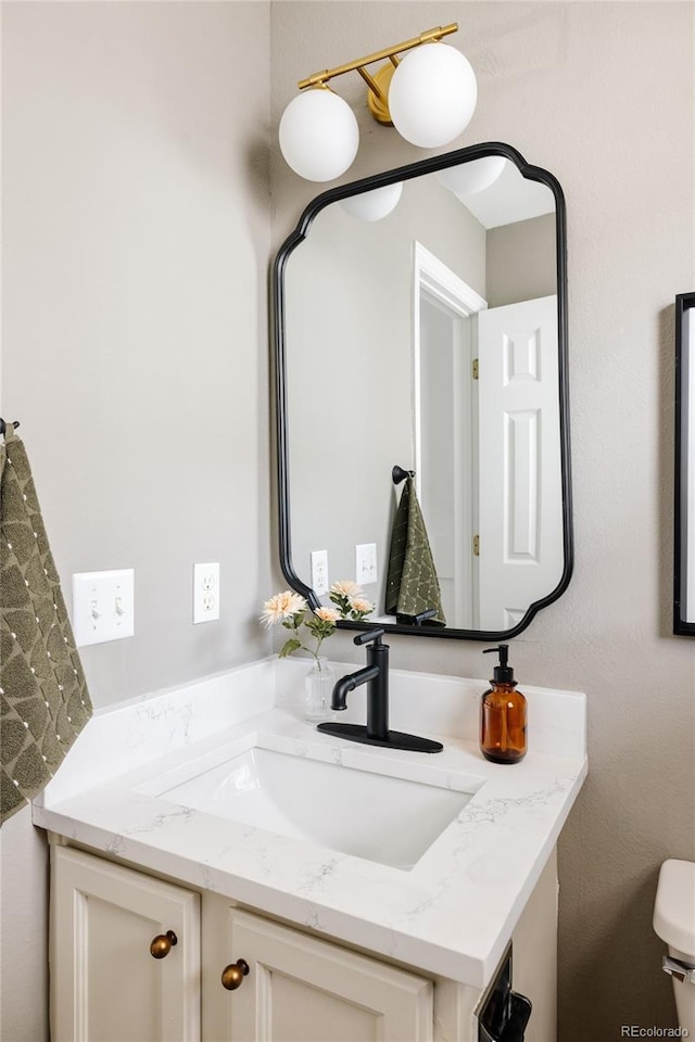 9756 Autumnwood Pl, Highlands Ranch, CO 80129 - half bathroom featuring vanity and toilet