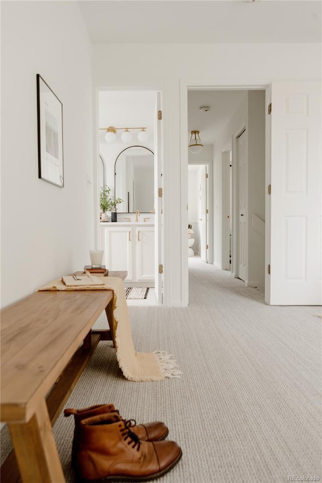 9756 Autumnwood Pl, Highlands Ranch, CO 80129 - hallway with light colored carpet