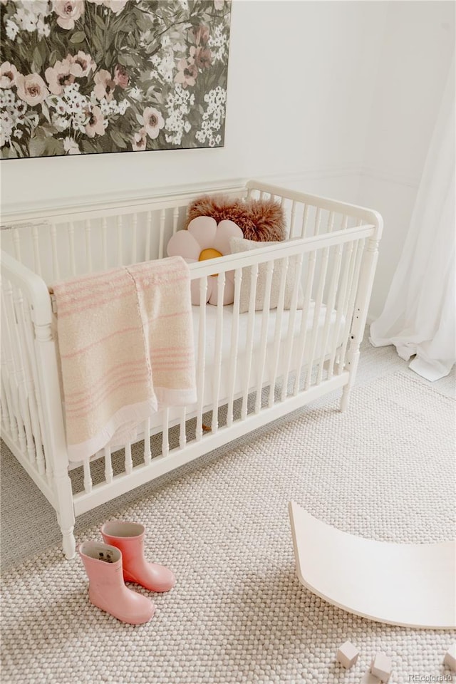9756 Autumnwood Pl, Highlands Ranch, CO 80129 - carpeted bedroom with a crib