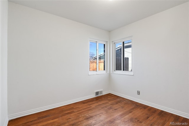 empty room featuring dark hardwood / wood-style floors