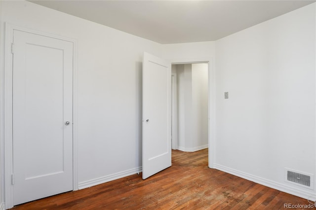 unfurnished bedroom featuring wood-type flooring