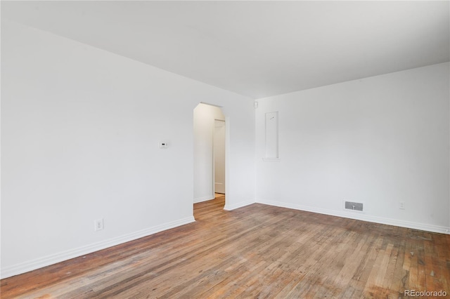 empty room with wood-type flooring