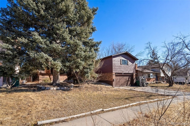 view of front of property with a garage and a front yard