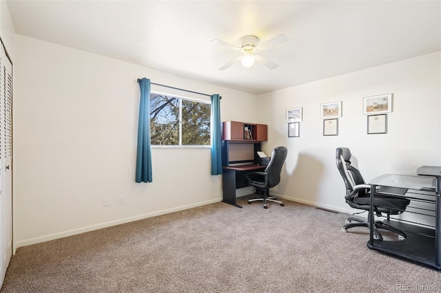 office area with carpet floors, baseboards, and a ceiling fan