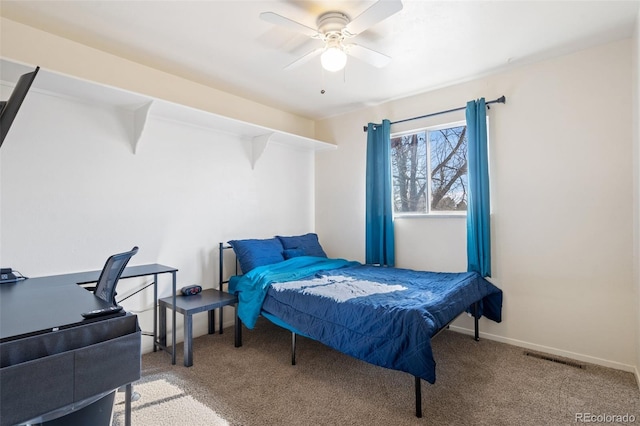 carpeted bedroom with visible vents, ceiling fan, and baseboards