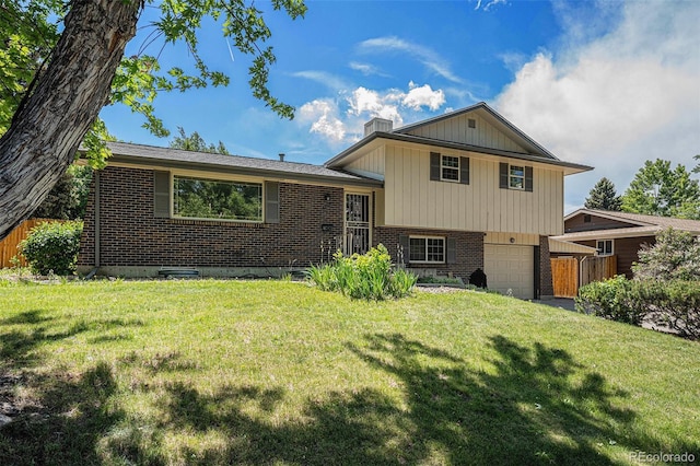 8346 W Woodard Dr, Lakewood, CO 80227 - view of front of property with brick siding, a garage, and a chimney