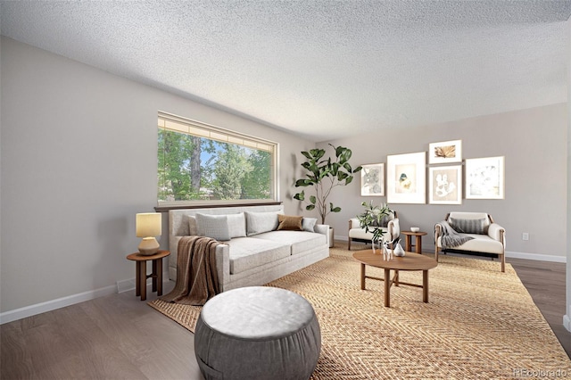 8346 W Woodard Dr, Lakewood, CO 80227 - living room featuring wood finished floors, a textured ceiling, and baseboards