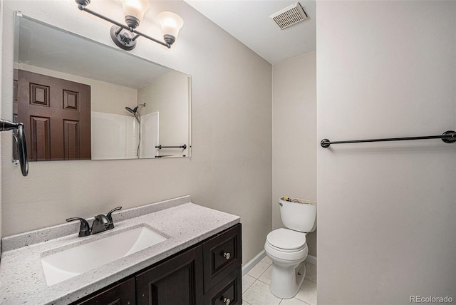 8346 W Woodard Dr, Lakewood, CO 80227 - full bath featuring toilet, vanity, tile patterned floors, and baseboards