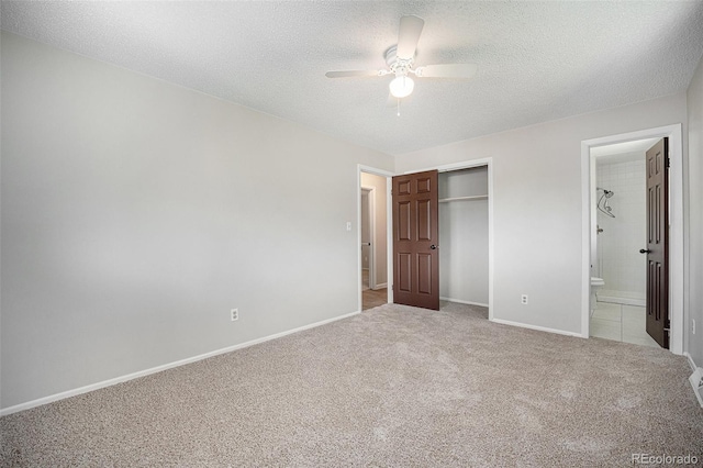 8346 W Woodard Dr, Lakewood, CO 80227 - unfurnished bedroom with light colored carpet, a closet, a textured ceiling, baseboards, and ensuite bath