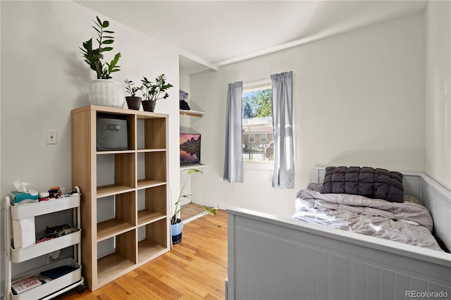 bedroom with wood-type flooring