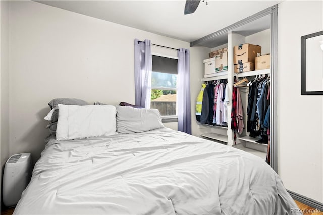 bedroom featuring a closet, hardwood / wood-style flooring, and ceiling fan