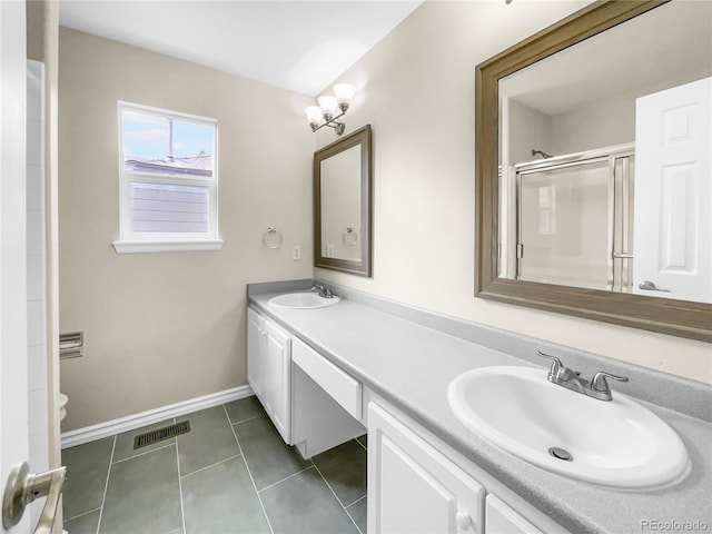 bathroom with vanity, toilet, an enclosed shower, and tile patterned flooring